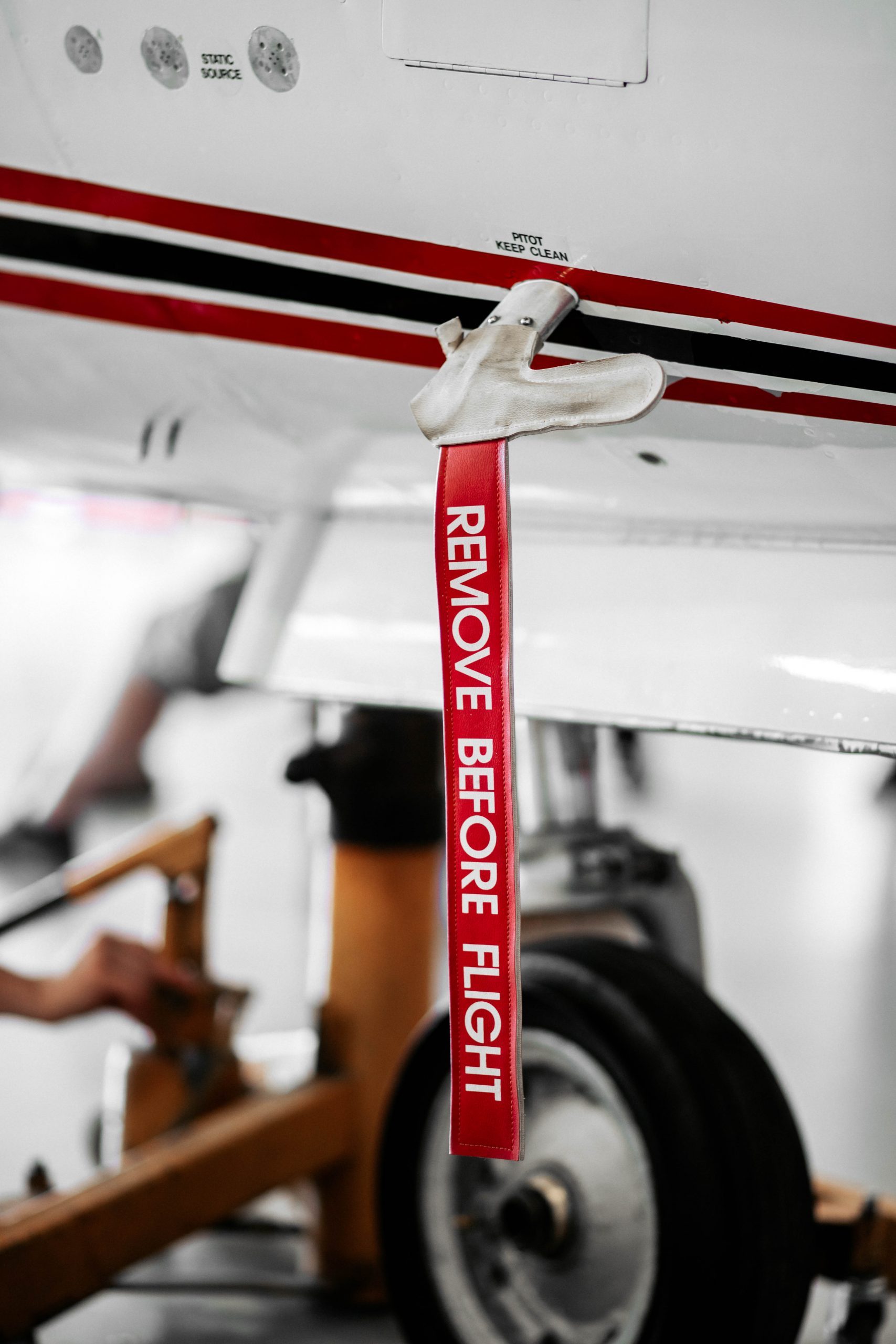 Remove before flight sign on an aircraft, Red remove before flight