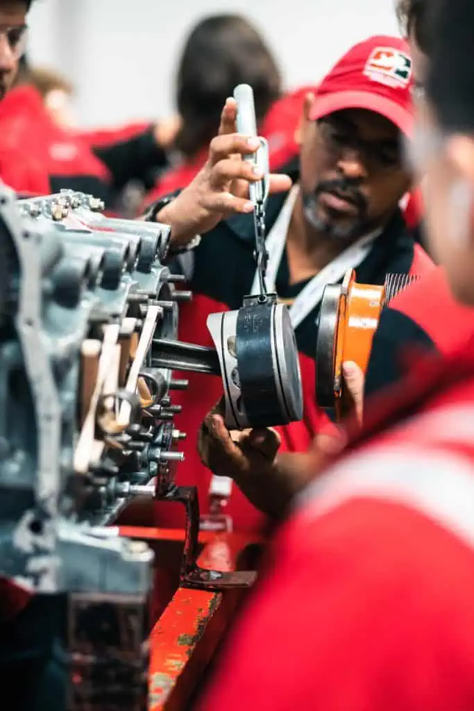 Aviation_Maintenanc_Technician_NAA_AI_Alternative An aviation maintenance technician works on an aircraft engine offsetting effects of AI technology